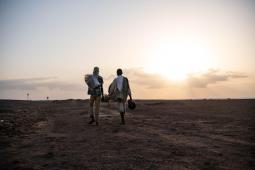 Two migrants are walking in the desert on the way to Obock, north of Djibouti